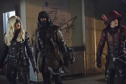 Arrow -- "Uprising" -- Image AR312A_0294b -- Pictured (L-R): Katie Cassidy as Black Canary, John Barrowman as Malcolm Merlyn and Colton Haynes as Arsenal -- Photo: Cate Cameron/The CW -- Ã?Â© 2015 The CW Network, LLC. All Rights Reserved.