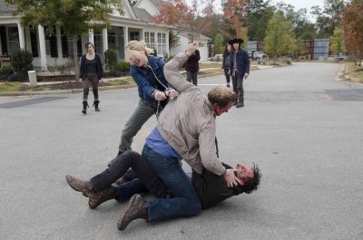 Christian Serratos as Rosita Espinosa, Katelyn Nacon as Enid, Chandler Riggs as Carl Grimes, Alexandra Breckenridge as Jessie, Corey Brill as Pete and Andrew Lincoln as Rick Grimes - The Walking Dead _ Season 5, Episode 15 - Photo Credit: Gene Page/AMC