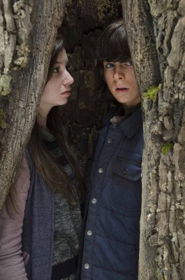 Chandler Riggs as Carl Grimes and Katelyn Nacon as Enid - The Walking Dead _ Season 5, Episode 15 - Photo Credit: Gene Page/AMC