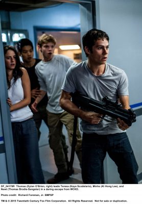 MAZE RUNNER: THE SCORCH TRIALS Thomas (Dylan O’Brien, right) leads Teresa (Kaya Scodelario), Minho (Ki Hong Lee), and Newt (Thomas Brodie-Sangster) in a daring escape from WCKD. Photo credit: Richard Foreman, Jr. SMPSP TM and © 2015 Twentieth Century Fox Film Corporation.  All Rights Reserved.  Not for sale or duplication.